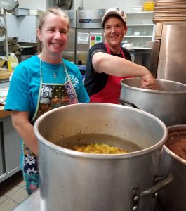 UNSUNG HEROES FOOD ASSISTANCE PROVIDERS PART 2 Women with big pots of food