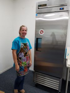 UNSUNG HEROES FOOD ASSISTANCE PROVIDERS PART 2 woman in front of freezer